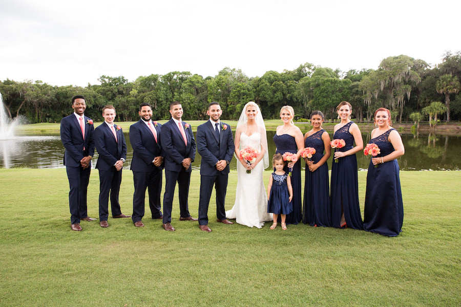 Outdoor, Bridal Party Portrait in Navy David's Bridal Bridesmaids Dresses and Blue Groomsmen Suits at Tampa Wedding Venue Tampa Palms Golf and Country Club