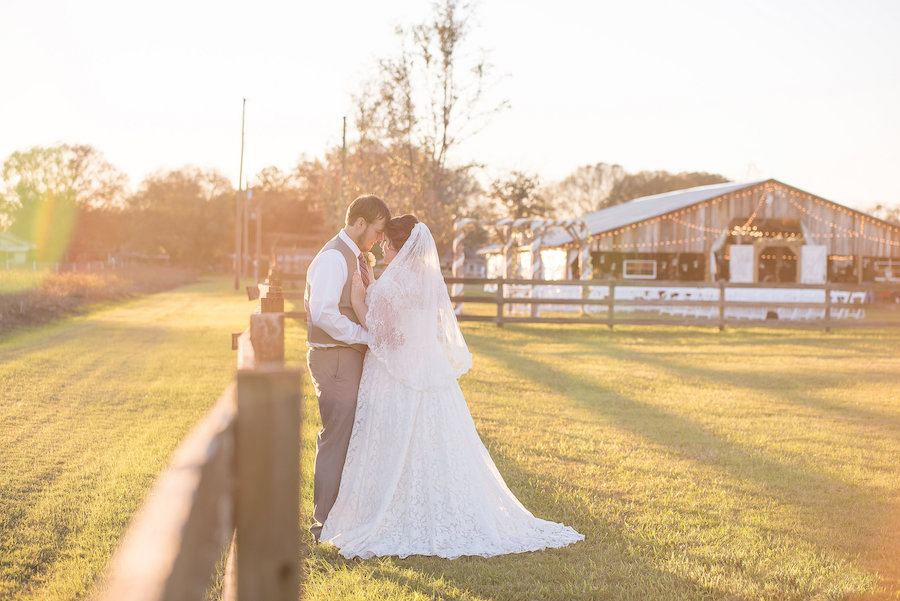 Outdoor, Plant City Bride and Groom Wedding Portrait in Front of Wooden Barn