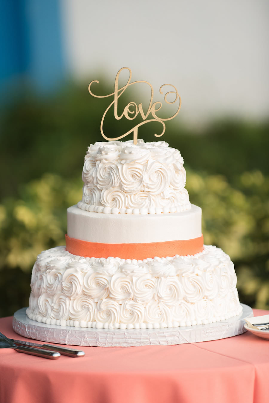 Three Tiered, White, Round Wedding Cake with Peach Accent and Rosette Icing and Gold Love Cake Topper | St. Petersburg Wedding Photographers Caroline and Evan Photography