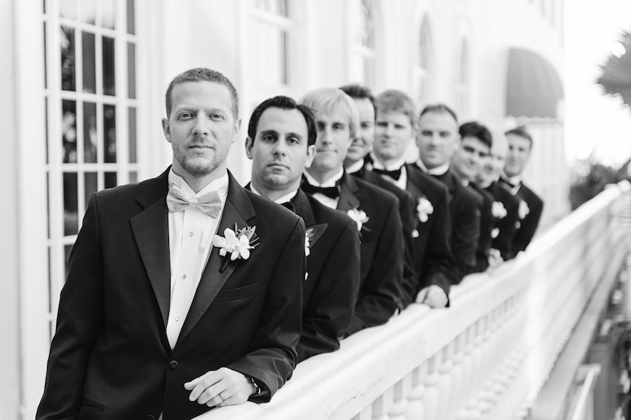 Bridal Party Groomsmen Wedding Portrait in Tuxedos and Bowties at Tampa Wedding Venue Loews Don CeSar Hotel | Tampa Wedding Photographer Marc Edwards Photographs