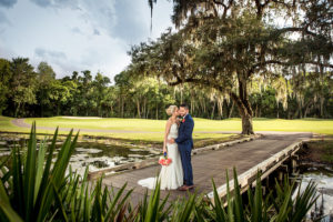 Bride and Groom Wedding Portrait on Boardwalk Overlooking Lake at Tampa Wedding Venue Tampa Palms Golf and Country Club