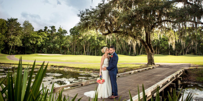 Bride and Groom Wedding Portrait on Boardwalk Overlooking Lake at Tampa Wedding Venue Tampa Palms Golf and Country Club