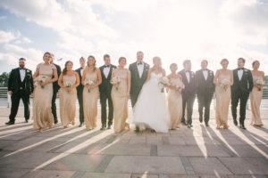 Outdoor Tampa Bridal Party Wedding Portrait | Champagne Gold Sorella Vita Bridesmaid Dresses with White Sweetheart Hayley Paige Wedding Gown and Black Tuxedos