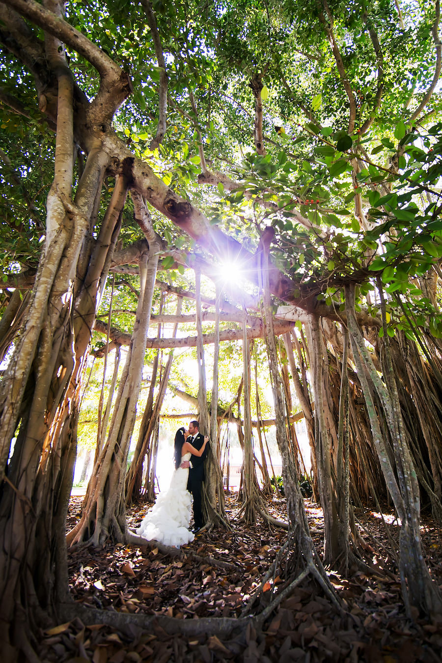 Outdoor Bride and Groom Wedding Portrait in Banyan Trees | Bride in Maggie Sottero Dress | Sarasota Wedding Venue Ca' d'zan Ringling Mansion | Sarasota Wedding Photography Limelight Photography