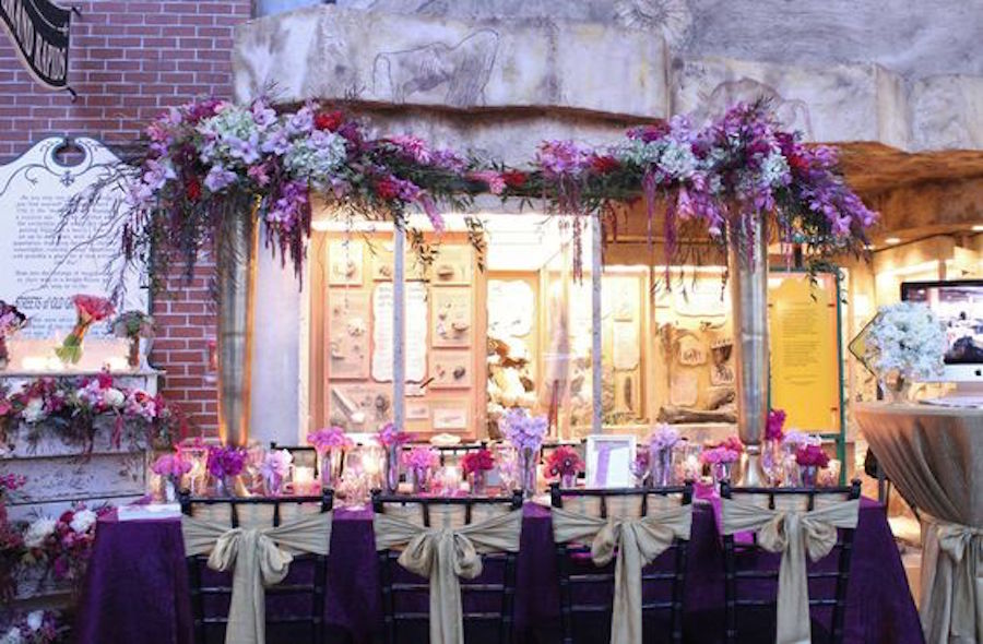 Dark Purple Wedding Table Linens with Extravagant Floral Arch and Gold Chair Sash Bows | Tampa Bay Wedding Rental Linens by Connie Duglin Specialty Linens