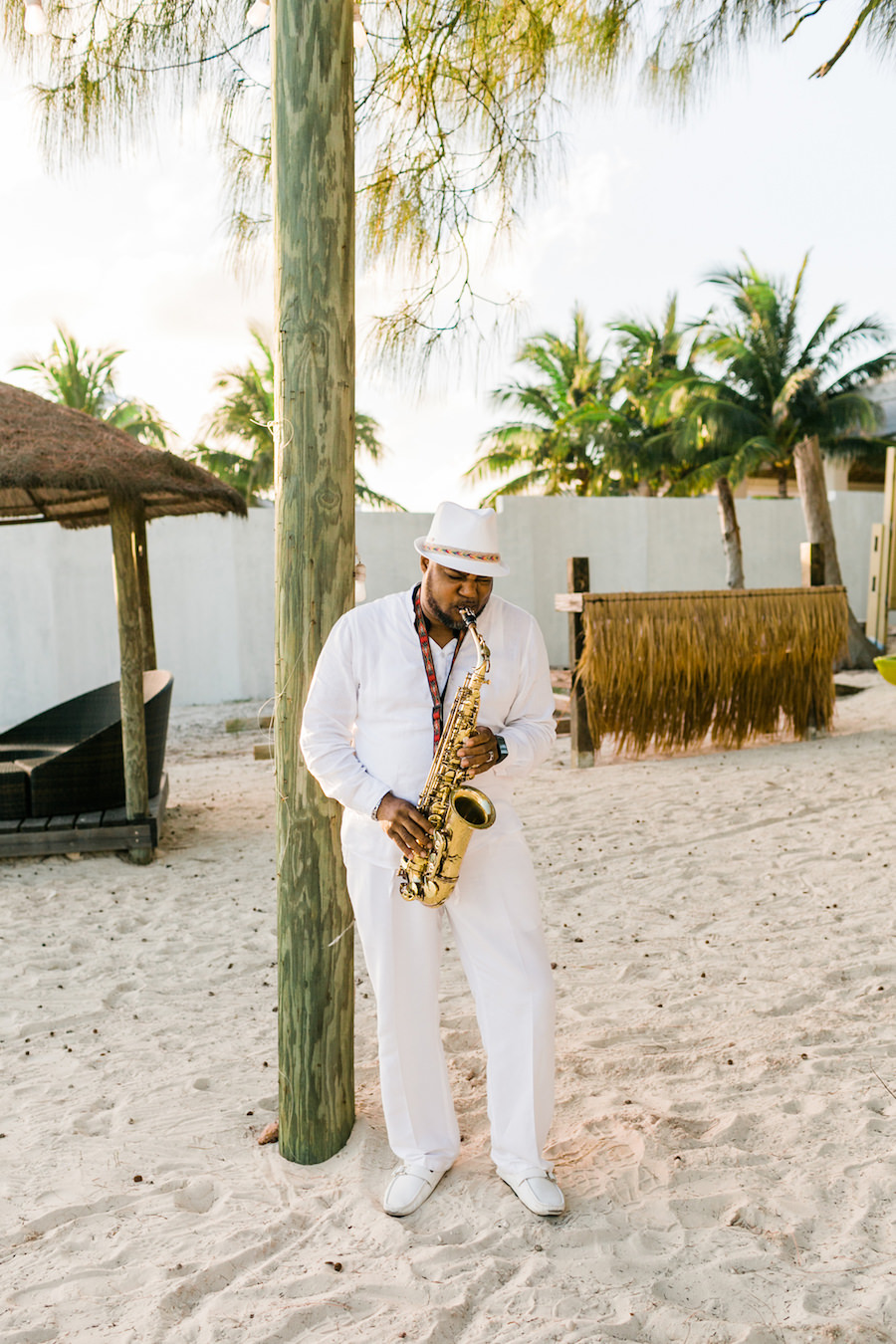 Outdoor Beach Wedding with Live Saxophone Musician Entertainment | White Wedding Inspiration | Sandals Royal Bahamian Bahamas Destination Honeymoon and Wedding | Wedding Photographer AlexisJuneWeddings