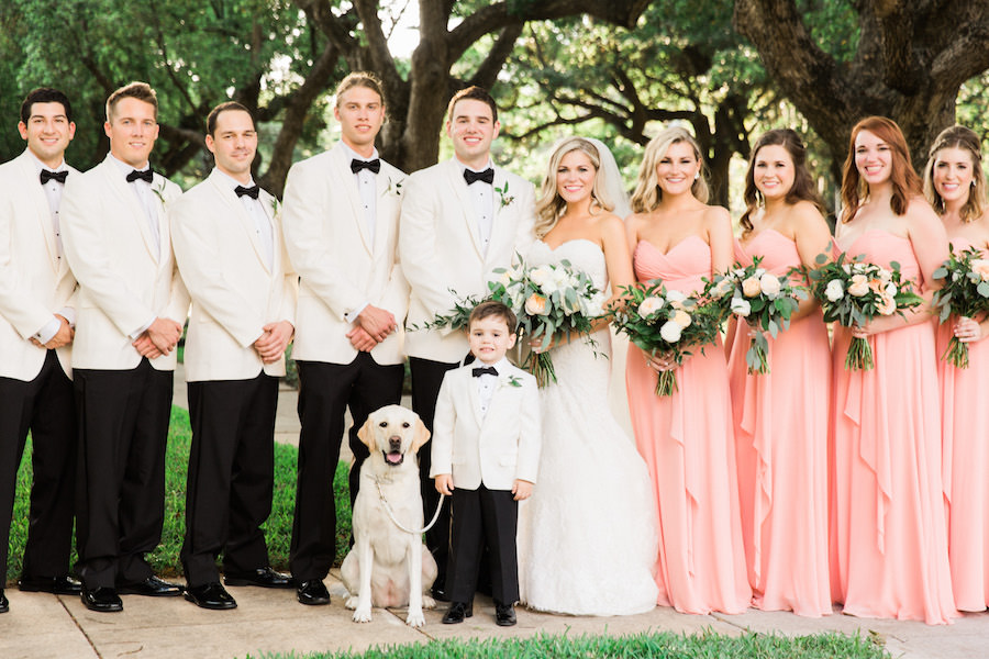 Outdoor, Tampa Wedding Bridal Party Portrait with Groomsment in White Tuxedo Jackets and Coral Bridesmaids Dresses with Dog