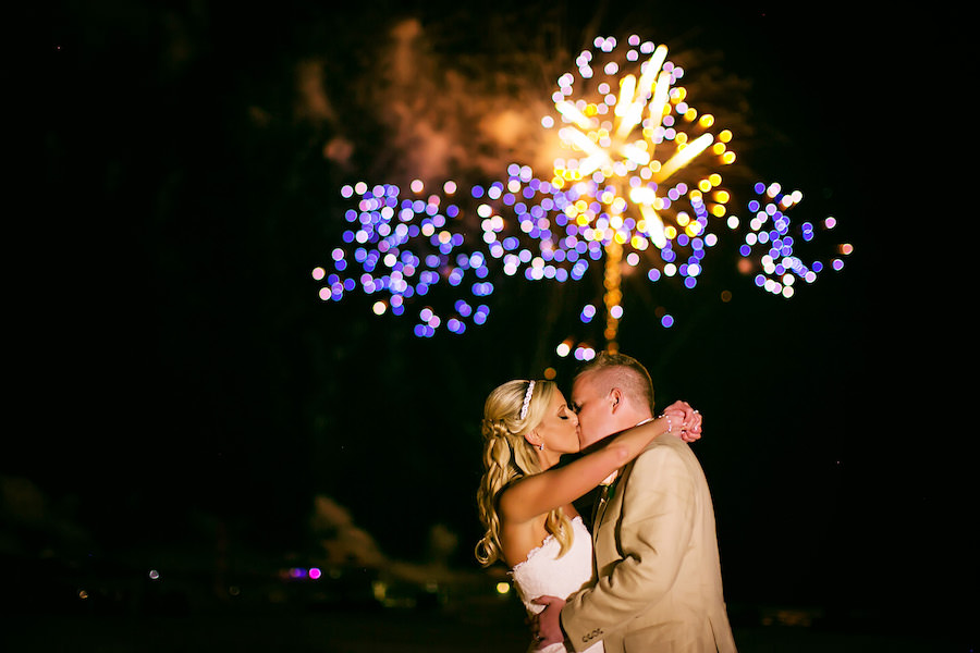 Beach Bride and Groom Wedding Portrait with Fireworks | Outdoor, Waterfront, Sunset Silhouette Bride and Groom Wedding Portrait | Hilton Clearwater Beach Wedding | Wedding Photographer Limelight Photography