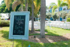 Blue St. Petersburg Welcome Sign at Waterfront Beach Wedding