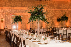 Indoor, Ballroom Wedding Reception Decor with Tall, Greenery Centerpieces in Glass Vases, Bamboo Chiavari Chairs, and Candlelight | Tampa Wedding Venue Tampa Marriott Waterside