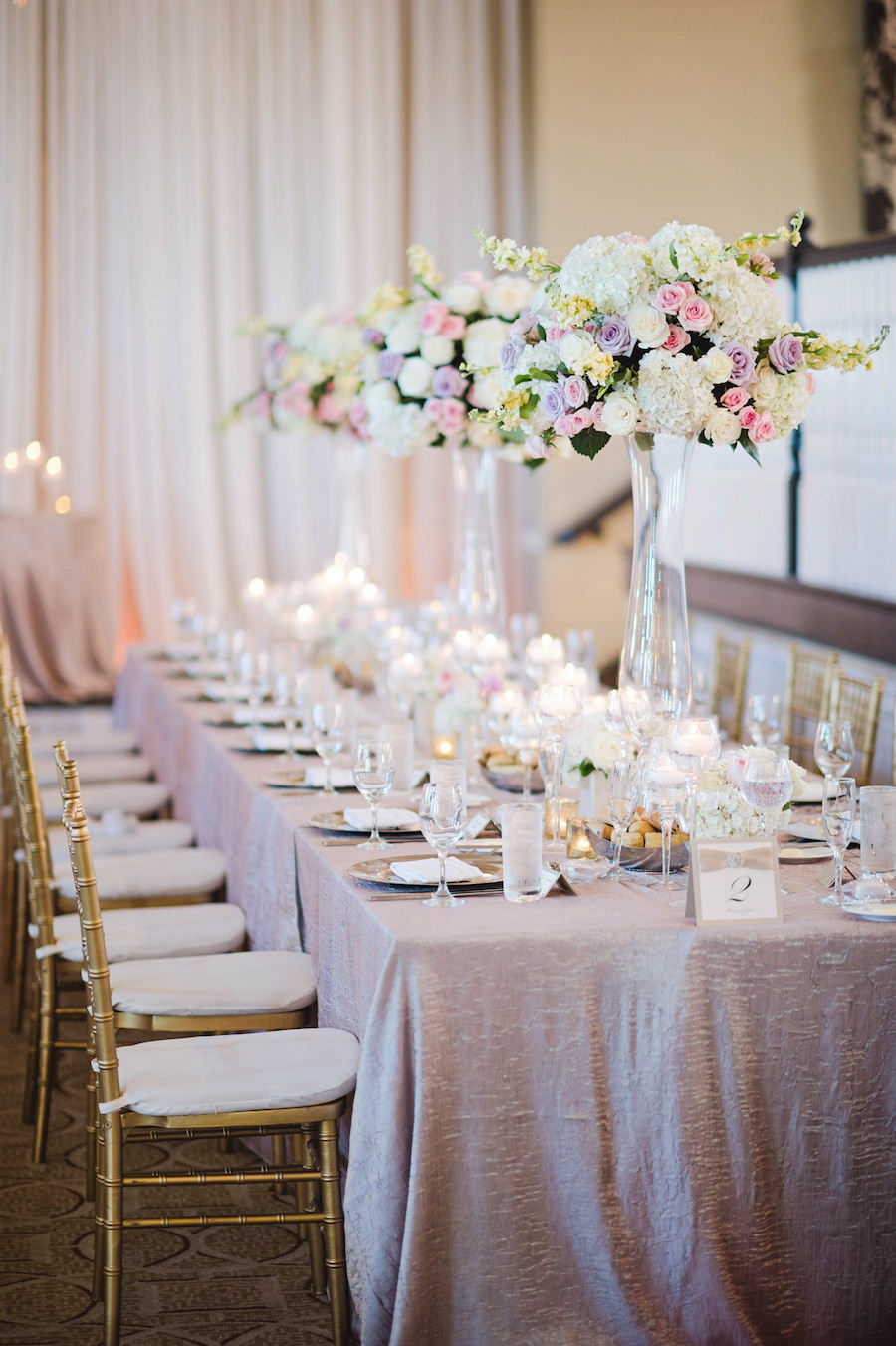 Classic Wedding Reception with Tall Pink, Cream and Lilac Rose and Hydrangea Centerpieces on Feasting Tables at Tampa Wedding Reception Venue Loews Don Cesar Hotel | Tampa Wedding Photographer Marc Edwards Photographs