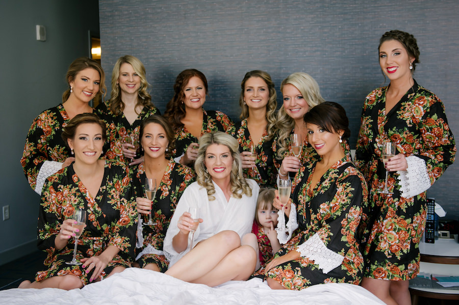 Bridesmaids Getting Ready Wedding Day Portrait in Black Floral and Lace Robes with Champagne