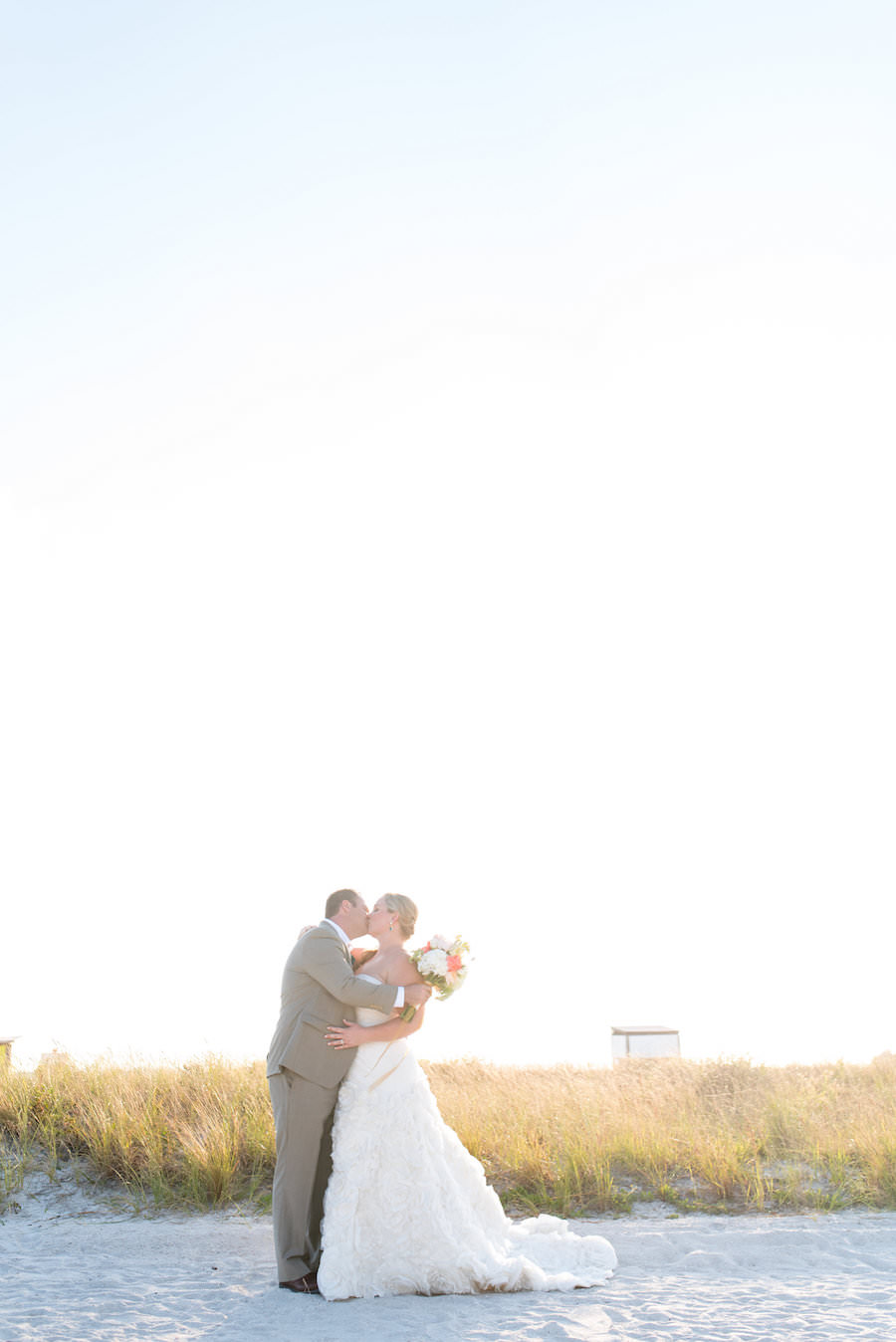 Waterfront, Outdoor Bride and Groom Wedding Portrait on St. Petersburg Beach | St. Petersburg Wedding Photographers Caroline and Evan Photography