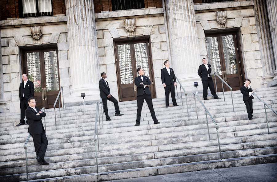 Groom in Black Tuxedo and Groomsmen in Black Suits | Bridal Party Wedding Portrait in Downtown Tampa