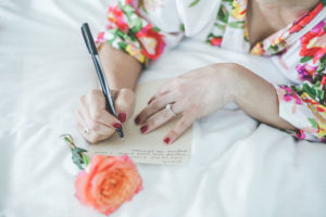 Bride Writing Groom Letter on Wedding Day