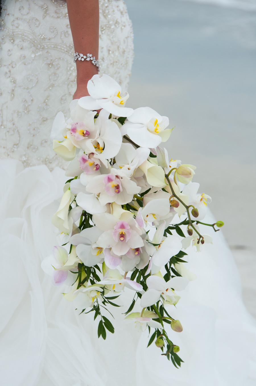 White Orchid and Lily Cascading Wedding Bouquet with Greenery | St. Petersburg Wedding Photographer Castorina Photography