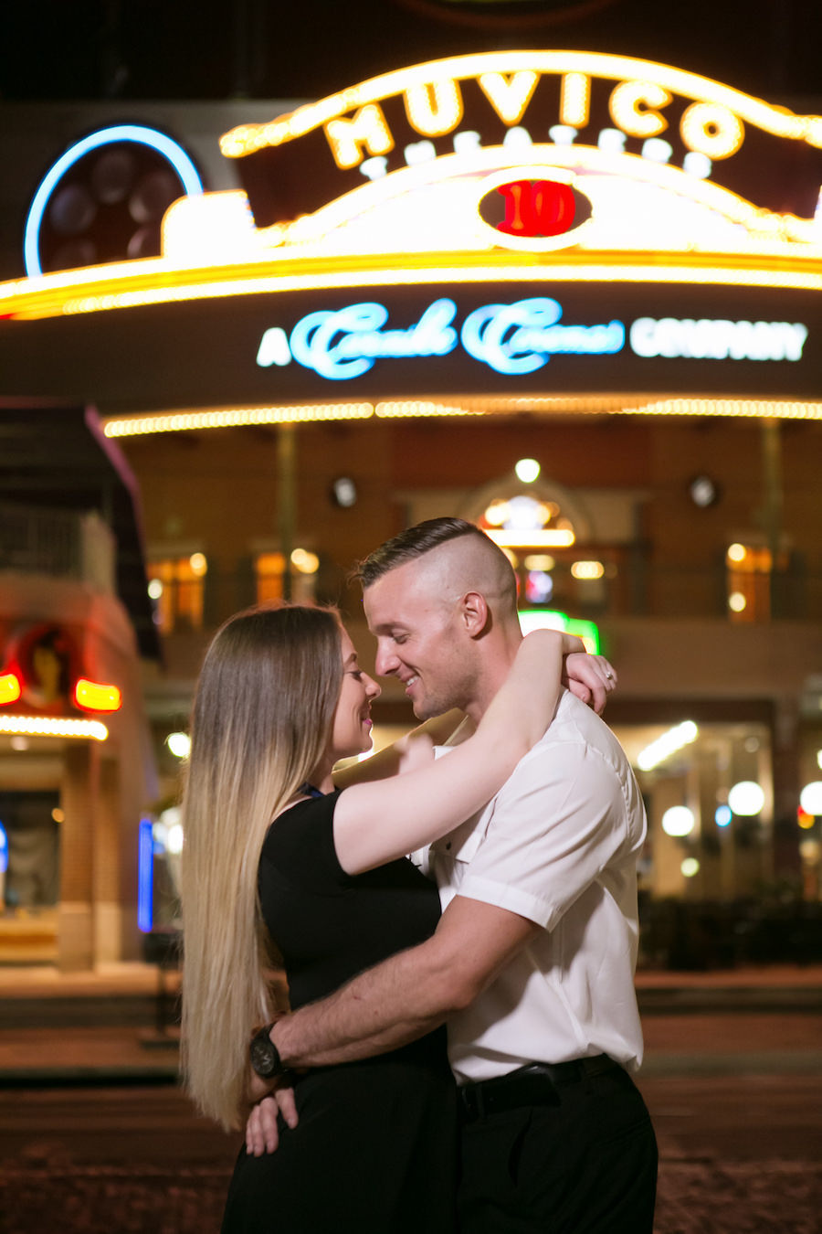 Engagement Portrait Outside of Old Fashioned Movie Theater in Tampa Florida Ybor City | Carrie Wildes Photography