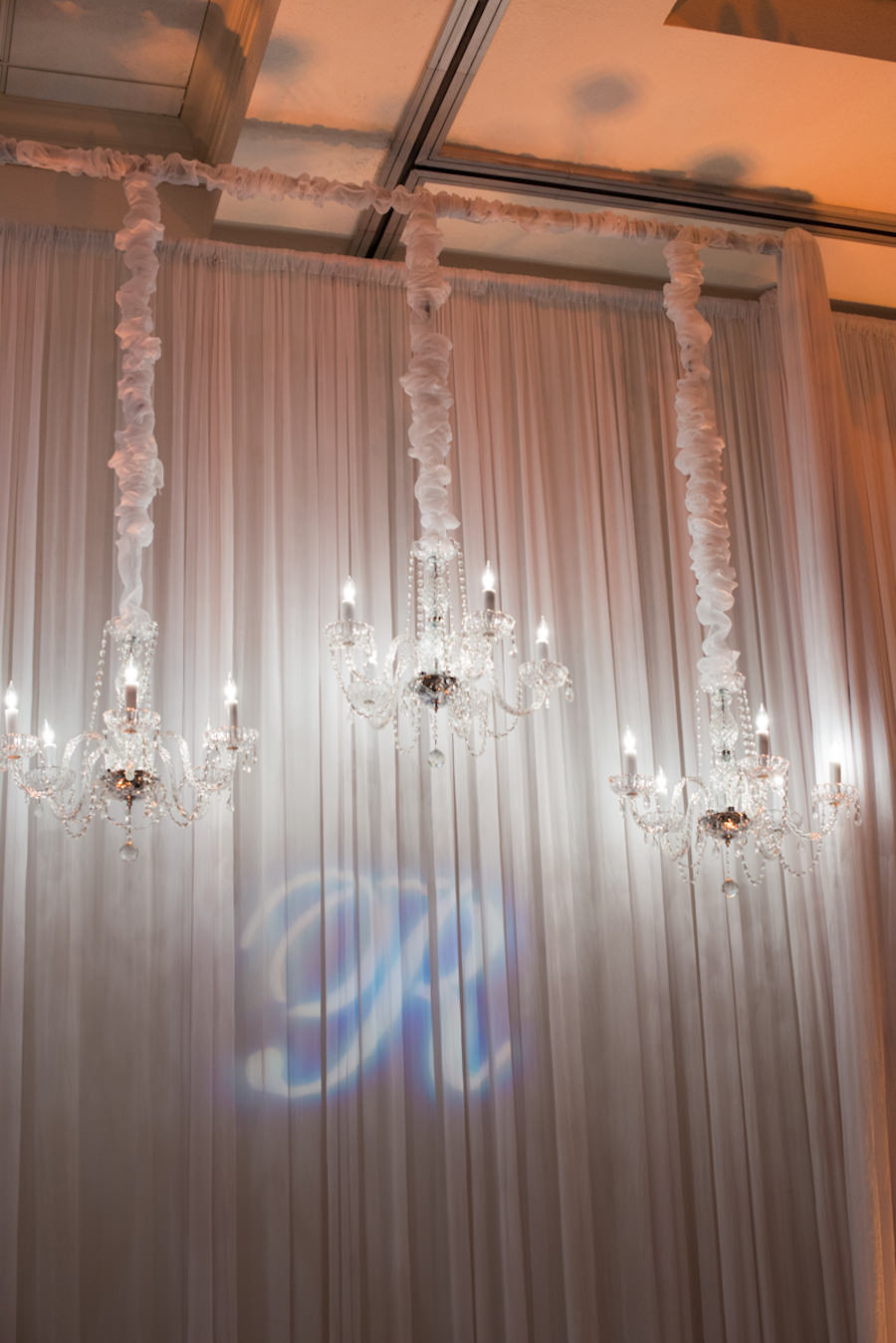 Wedding Monogram in Uplighting with Draping and Suspended Crystal Candelabras | St. Petersburg Wedding Photographer Castorina Photography