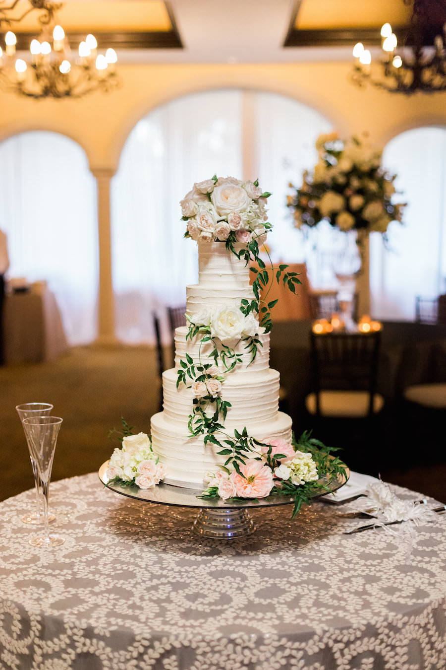 Five Tiered Ivory White Ruffled Wedding Cake with Fresh Ivory and Pink Floral Accent with Green Vine | Tampa Wedding Cakes and Desserts Hands on Sweets