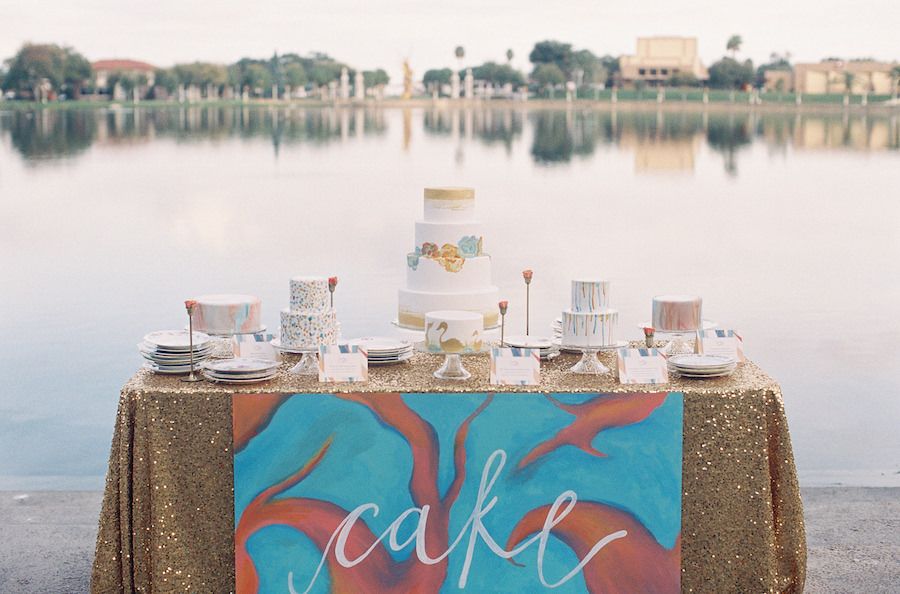 Wedding Cake Dessert Table with Gold Sequin Tablecloth and Assorted Round Wedding Cakes | Tampa Wedding Cakes and Desserts Hands on Sweets