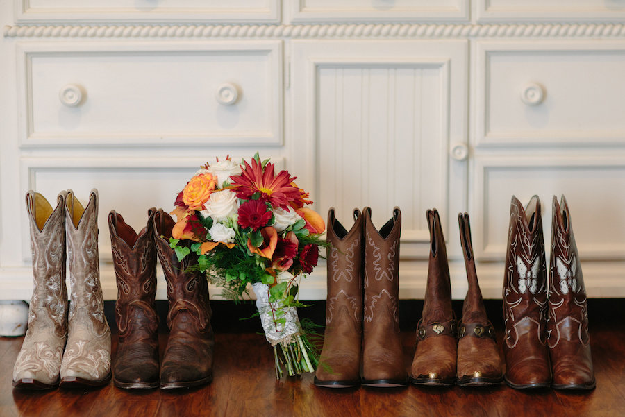 Bride and Bridesmaids Cowgirl Boots for Rustic Wedding and Orange and Red Bridal Bouquet