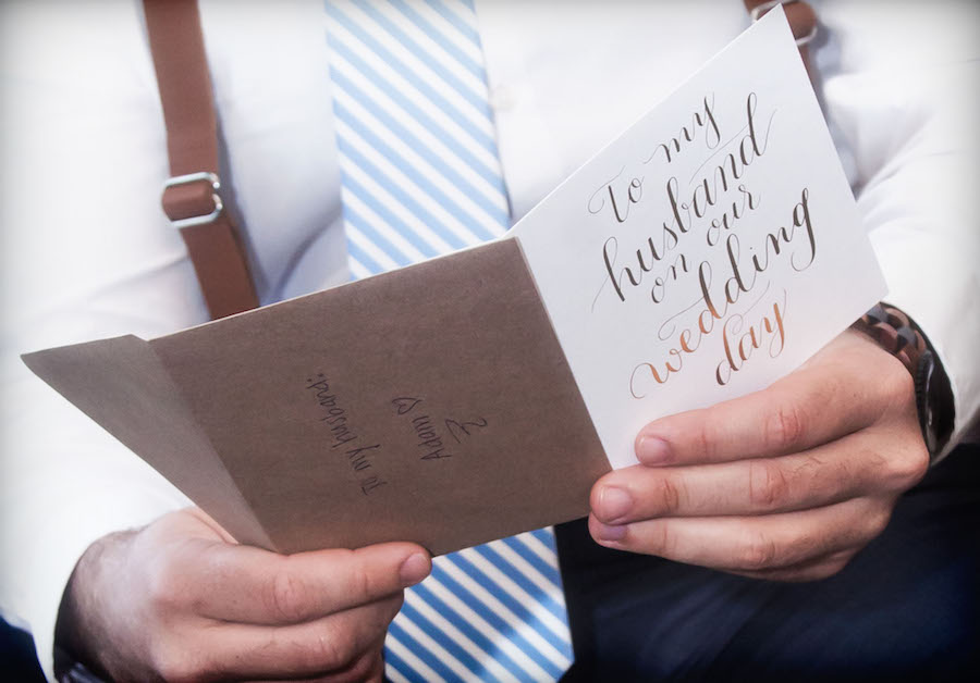 Groom Reading Card From Bride on Wedding Day