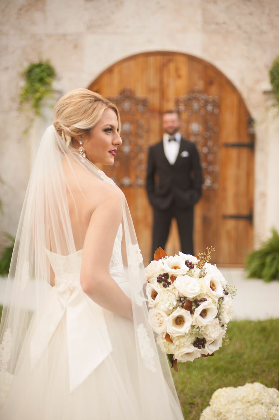 Bridal Wedding Portrait in Strapless, Ivory Wedding Dress with Detachable Chiffon Skirt and Bow In The Back with Ivory and Brown Floral Wedding Bouquet of Anemone and Baby’s Breath | Fall Wedding Inspiration