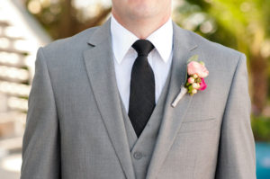 Groom's Grey Suit and Black Tie with Pink Peony Boutonniere Detail