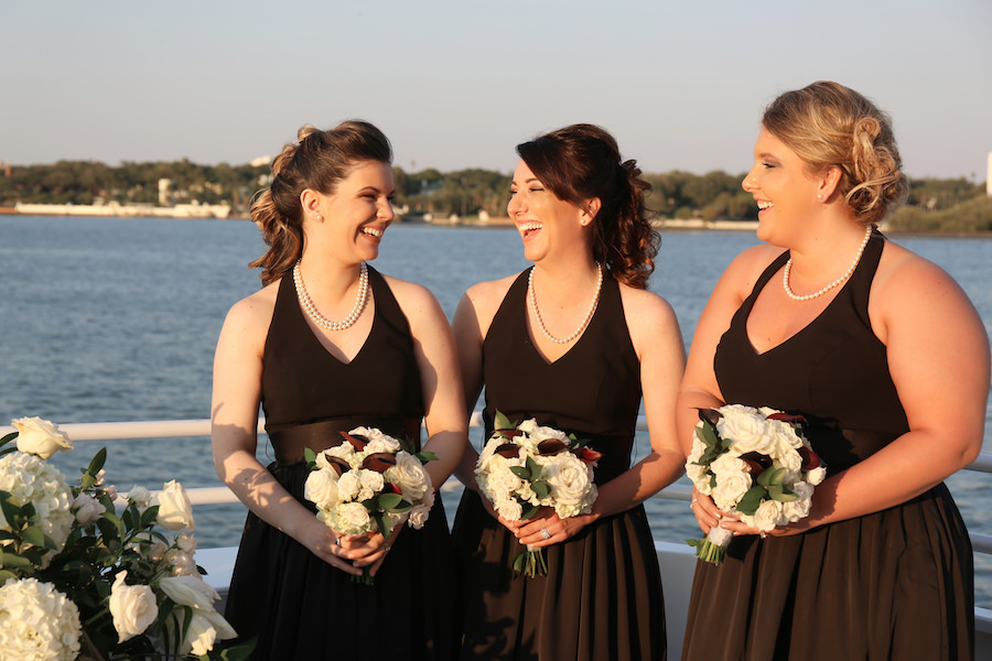 Bridesmaids Wedding Portrait in Black Halter Dresses and Pearl Necklaces