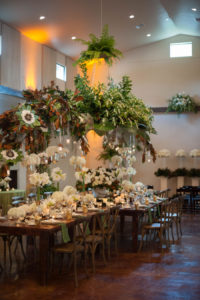 Green and Ivory Wedding Reception Décor with Green Linen Napkins on Mahogany Wood Table and Chairs | Fall Wedding Inspiration | Nature Inspired Wedding