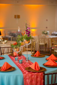 Tropical Wedding Centerpieces by St. Pete Wedding Florist Wonderland Floral Art and Gift Loft | Blue Teal Linens with Orange Runner by Custom Linens | Mahagony Chiavari Chairs by A Chair Affair