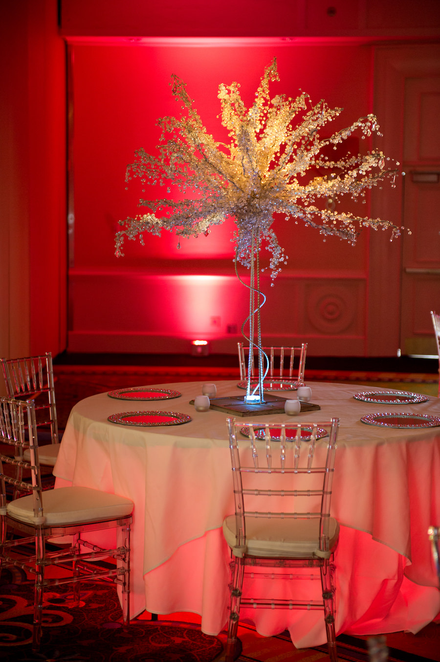 Non-Flower Wedding Centerpiece and Clear Chiavari Chairs by A Chair Affair | Uplighting by Nature Coast Entertainment Services | Wedding Venue Tampa Airport Marriott | Andi Diamond Photography