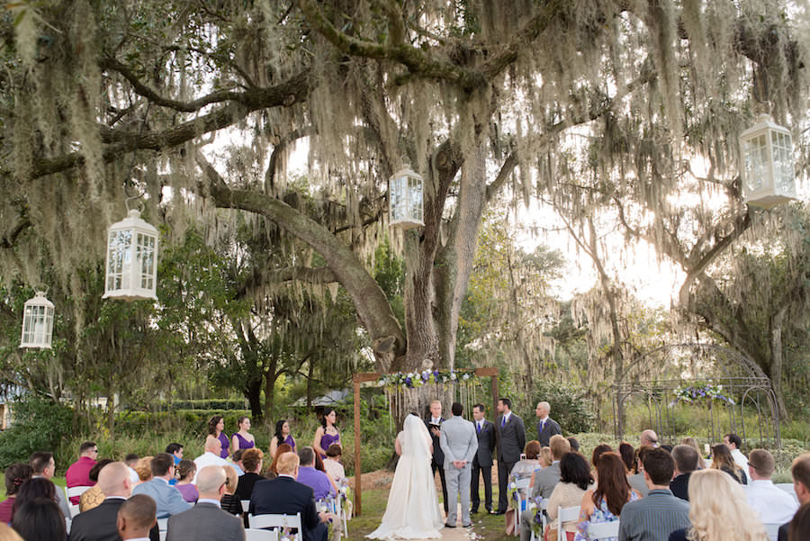 Rustic Outdoor Wedding Ceremony under Spanish Moss Tree at Tampa Wedding Venue Cross Creek Ranch | Photographer Caroline and Evan Photography