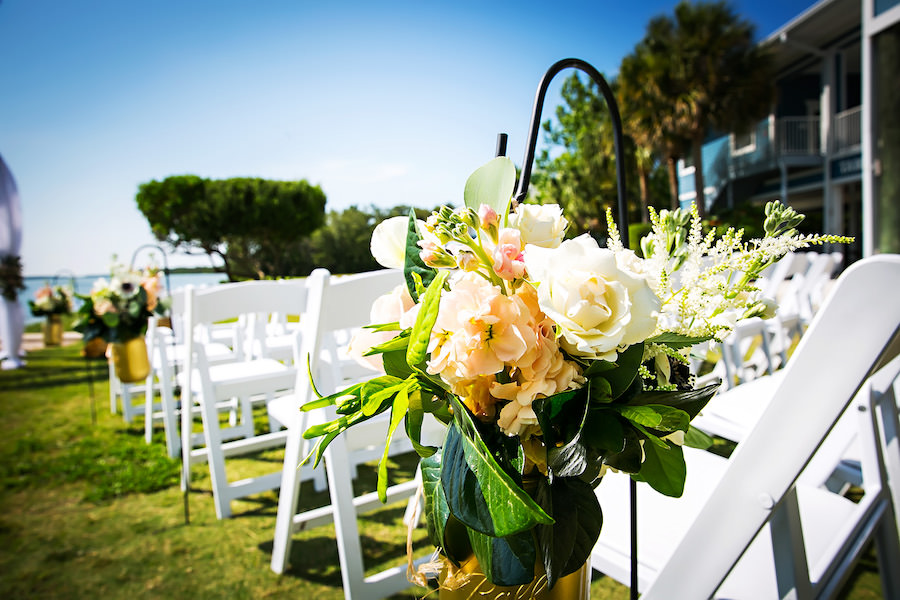 Waterfront St. Petersburg Wedding Ceremony with Pastel Peach Flowers on Shepherd Hooks and White Folding Garden Chairs