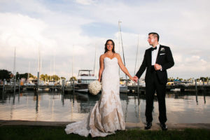 Downtown St Pete Bride and Groom Wedding Portrait in Black Tuxedo and Ivory and Champagne Strapless Sweetheart Lace Wedding Dress with Ivory Rose Wedding Bouquet | Wedding Photographer Limelight Photography