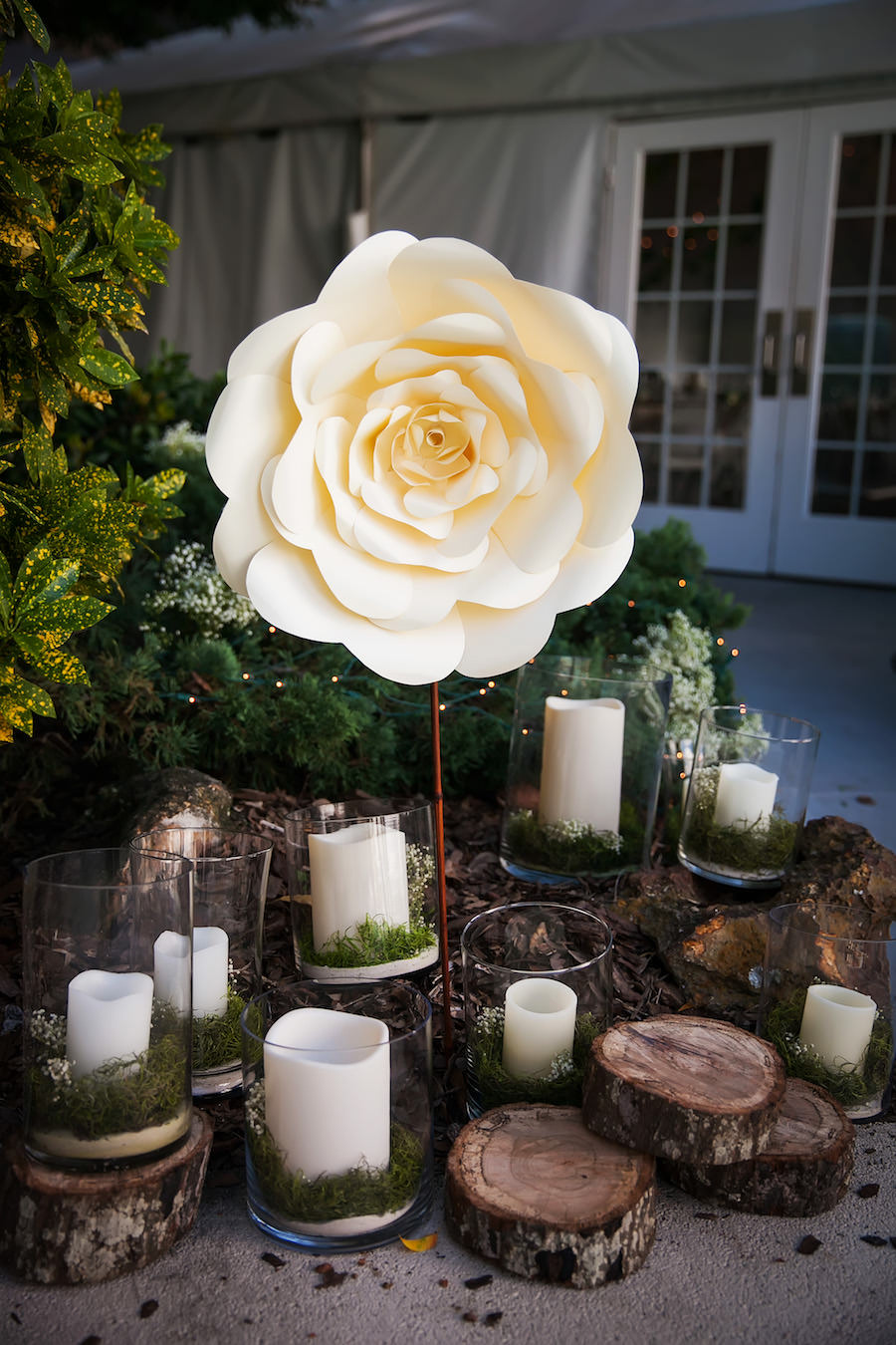 Paper, Floral Decor at Outdoor Waterfront Garden Wedding Ceremony | Mid-Summer's Night Dream Whimscial Wedding | Wedding Reception Decor with Wooden Slabs, Candles, and Oversized Paper Flowers