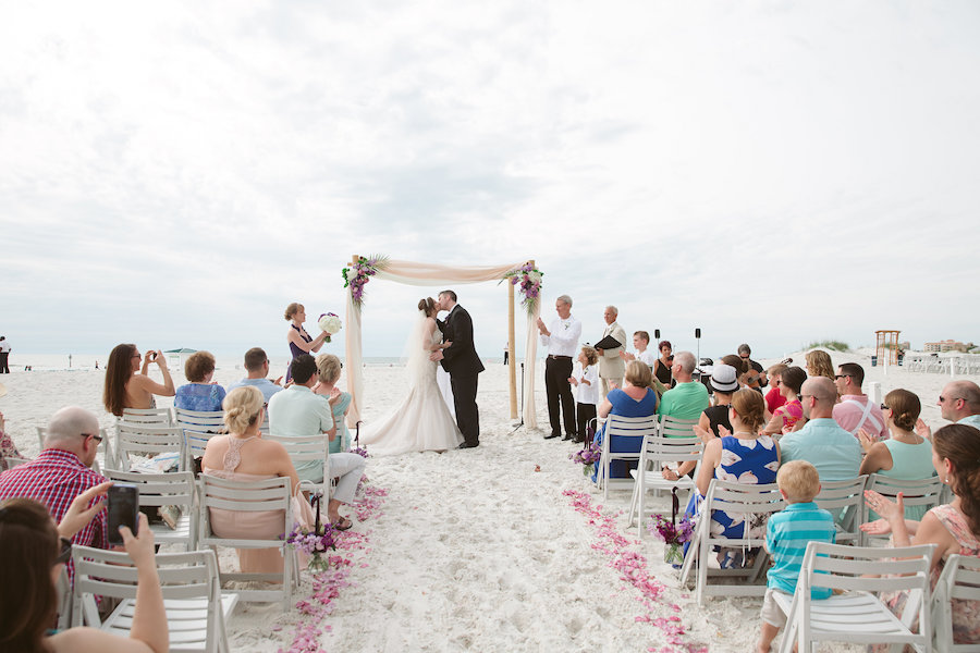 Bride and Groom First Kiss | Beach Wedding Ceremony with Bamboo Altar | Beach Wedding Ideas and Inspiration | Clearwater Beach Wedding Venue Hilton Clearwater Beach
