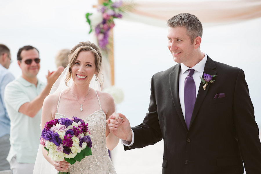 Bride and Groom Wedding Ceremony Recessional Portrait with Purple, Lilac and White Wedding Bouquet | Clearwater Beach Wedding Florist Iza's Flowers