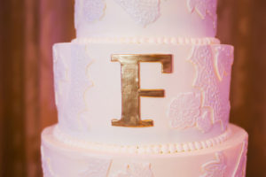 White Wedding Cake with Hand Painted Gold Monogram Initial and Lace Sugar Appliqué