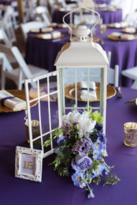 White Lanterns and Floral Centerpieces on Purple Linens Wedding Reception Table Décor | Rustic Garden Wedding Ideas and Inspiration