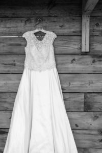 Rounded Neckline Beaded Wedding Dress with Cap Sleeves and Satin Skirt | Tampa Bay Wedding Photographer Caroline and Evan Photography