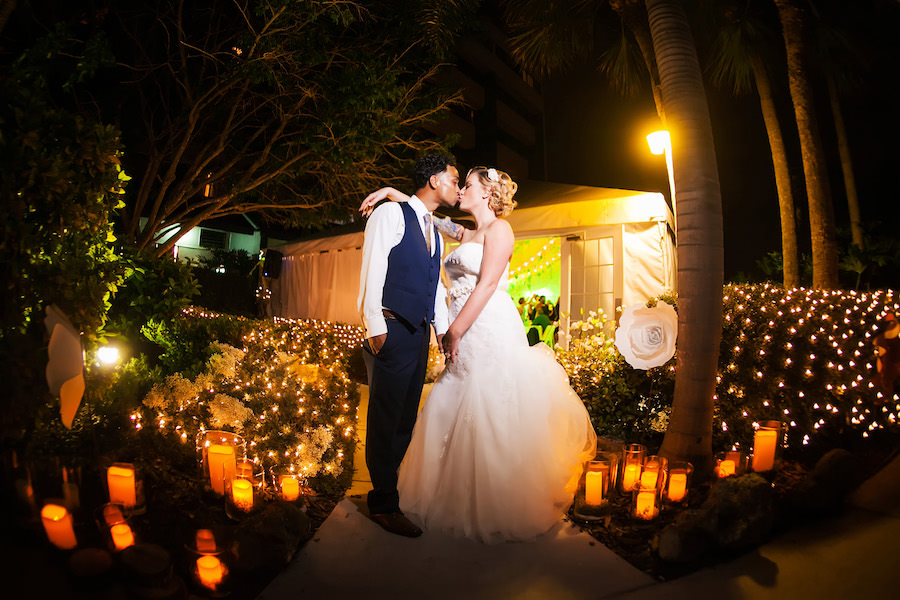 Bride and Groom, Outdoor, Nighttime Bridal Wedding Portrait Surrounded by Candlelight | Tampa Wedding Photographer Limelight Photography | Outdoor Tented Wedding Venue DoubleTree Suites by Hilton