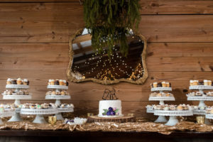 Rustic Cupcake Wedding Dessert Table on Sequin Specialty Linen | Wedding Cupcake Table Ideas and Inspiration | Wedding Cupcakes by Alessi Bakery in Tampa FL | Photography by Caroline and Evan Photography