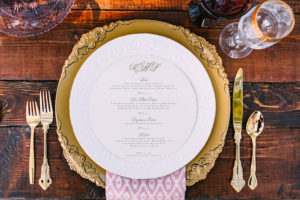 Boho Chic Wedding Reception Place setting with Gold Charger Plates from Ever After Vintage Weddings and A Chair Affair