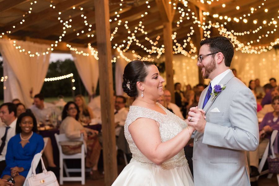 Bride and Groom First Dance Wedding Day Portrait at Tampa Wedding Reception Venue Cross Creek Ranch | Rustic Barn Wedding Ideas and Inspiration | Photograph by Caroline and Evan Photography