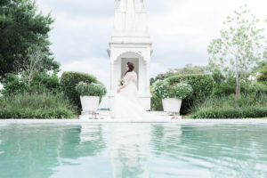 Bridal Outdoor Lakeland Wedding Portrait in Front of Fountain in Hayley Paige Wedding Gown