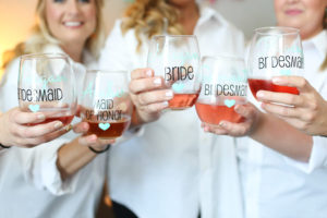 Wedding Day Bridesmaids Getting Ready Portrait with Custom Wine Glasses and Button Down Shirts