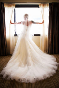 Indoor, Bridal Wedding Portrait in Window with Strapless, White Wedding Dress and Veil | Tampa Wedding Photographer Limelight Photography