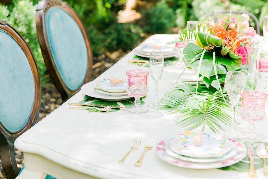 Tropical, Lilly Pulitzer Inspired Wedding Table Runner with Tropical Leaves and Vibrant Florals with Teal Vintage Chairs | The Reserve Vintage Rentals