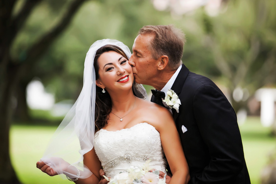 Outdoor, Bridal Wedding Portrait Groom Kissing Bride's Cheek | St. Petersburg Wedding Photographer Limelight Photography